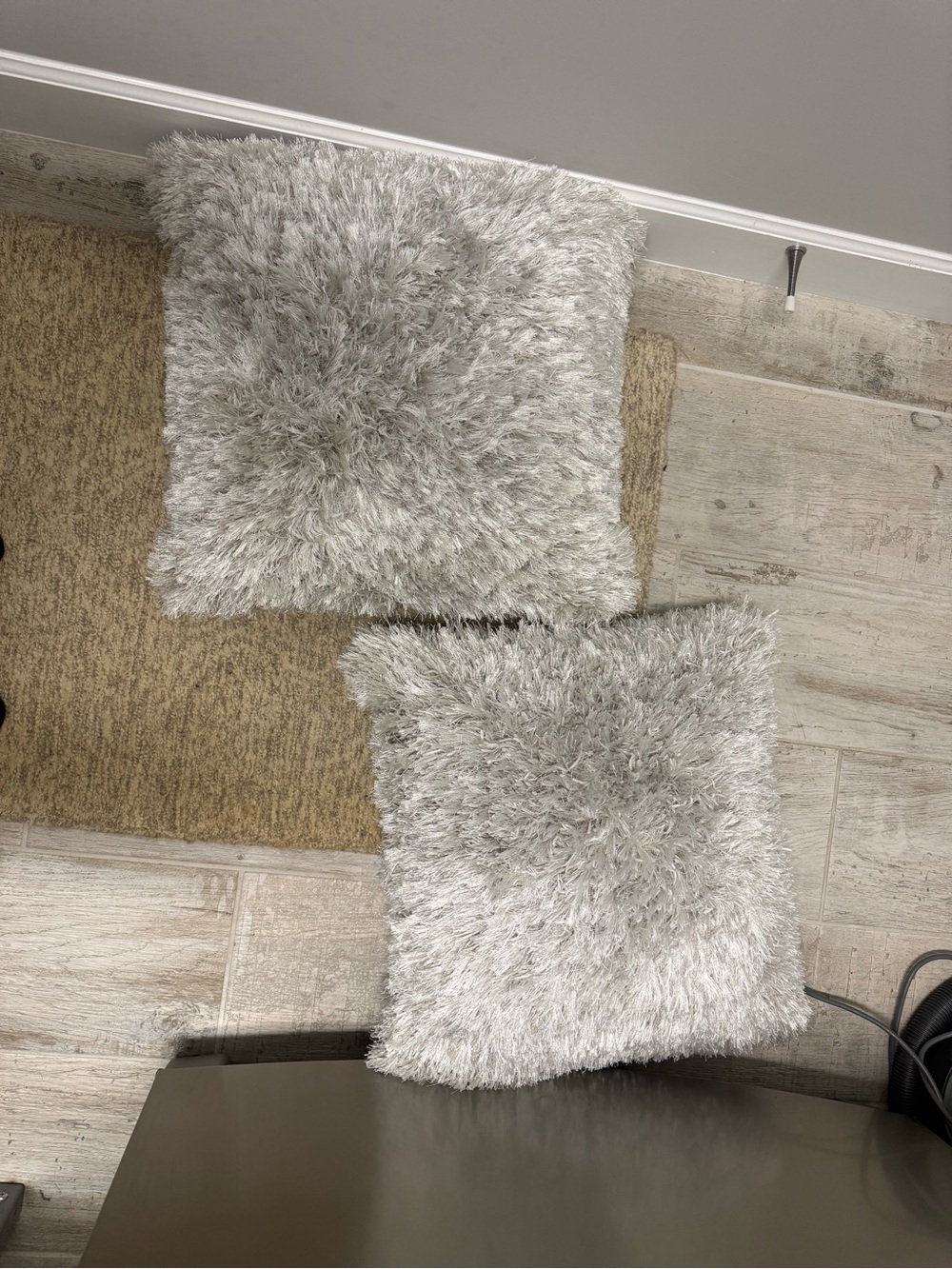 2 furry accent pillows